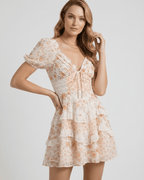Coral Mini Dress by Lauven, featuring soft floral print, tiered ruffles, and elegant A-line silhouette for a romantic look.