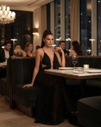 Eclipse Maxi Dress – Elegant black dress with deep V-neck, cut-out detail, and flowing silhouette by Lauven.