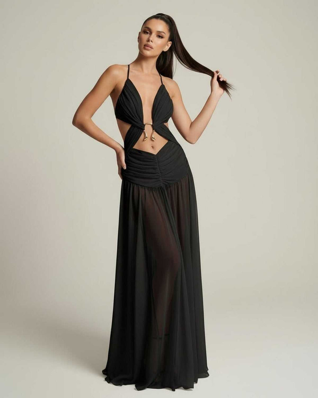 Eclipse Maxi Dress showcasing a black flowing silhouette with deep V-neck and cut-out details by Lauven.
