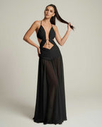 Eclipse Maxi Dress showcasing a black flowing silhouette with deep V-neck and cut-out details by Lauven.