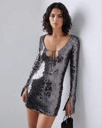 Lauven Eestella Mini Dress with sequined shine and flared sleeves, showcasing a sleek silhouette and modern design.