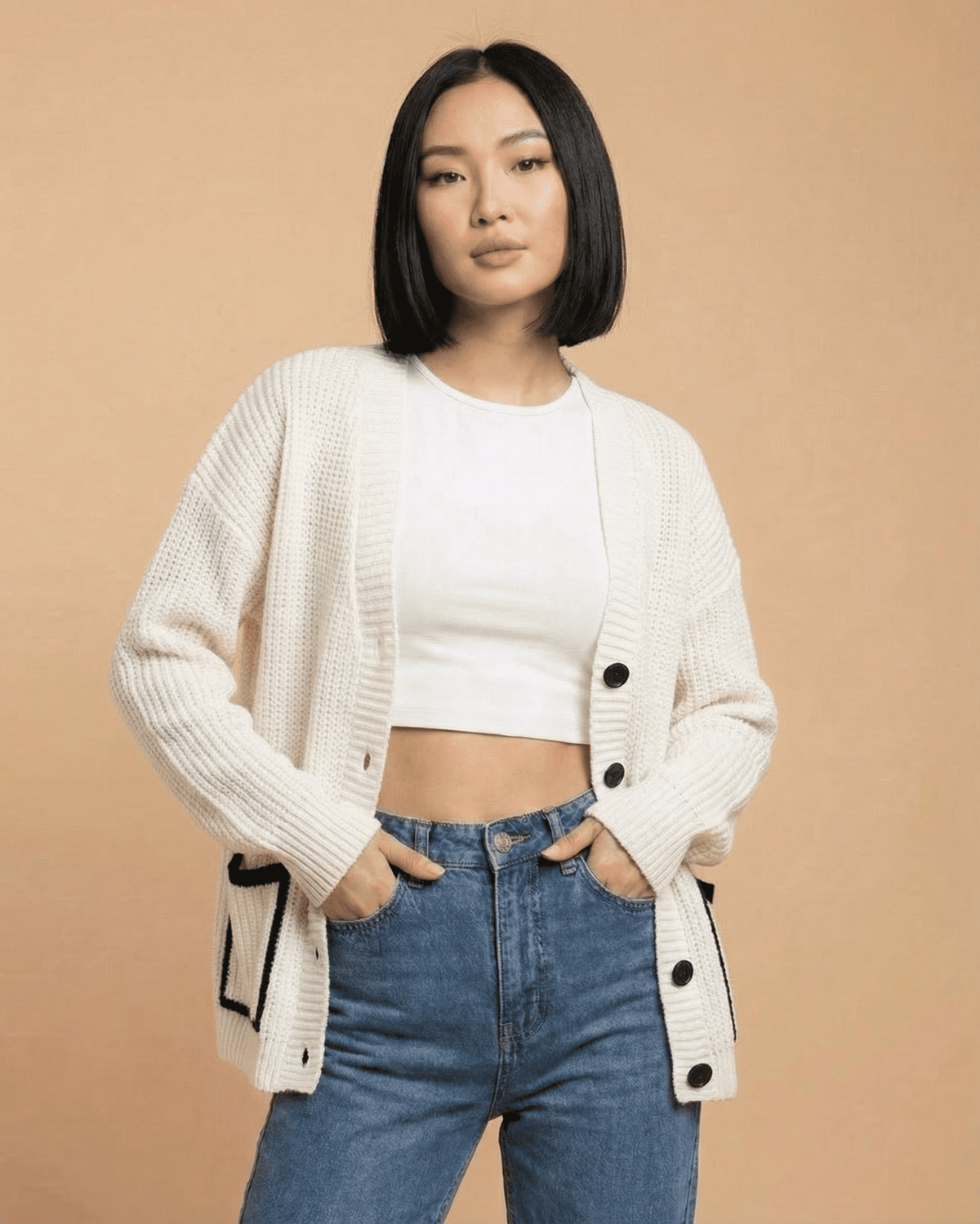 Elara Cardigan by Lauven, featuring a loose fit, V-neck, color block knit design on a model.