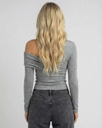 Back view of woman wearing Elara Long Sleeve off-the-shoulder top by Lauven in gray.