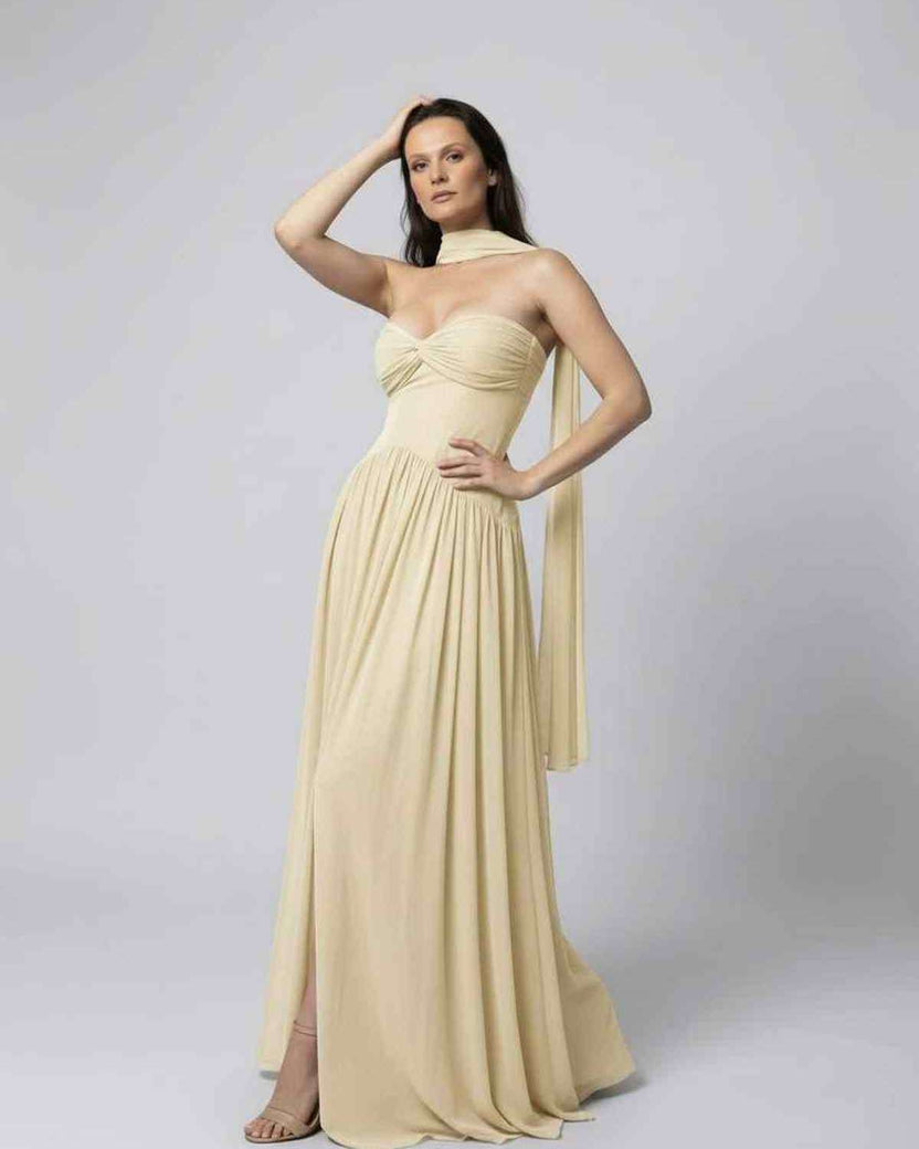 Elara Maxi Dress - Elegant beige strapless dress with choker scarf, showcasing graceful movement, by Lauven.