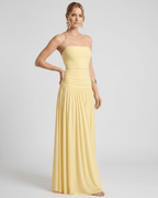 Elara Maxi Dress in yellow, featuring a halter neck, smooth stretch jersey, and billowy skirt by Lauven.