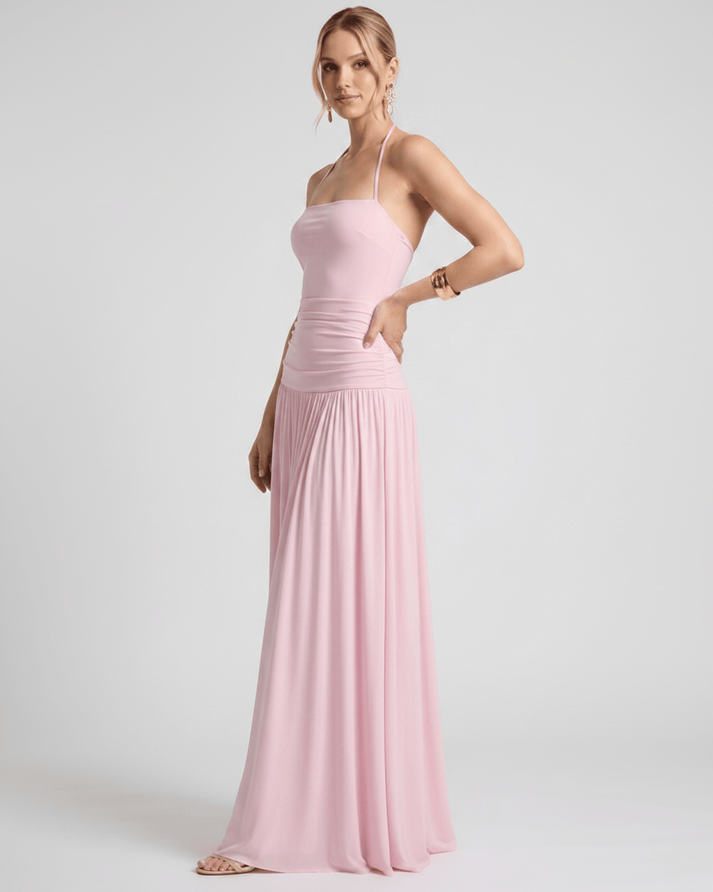 Elara Maxi Dress in soft pink stretch jersey, featuring halter neck and elegantly flowing skirt for a refined look by Lauven.