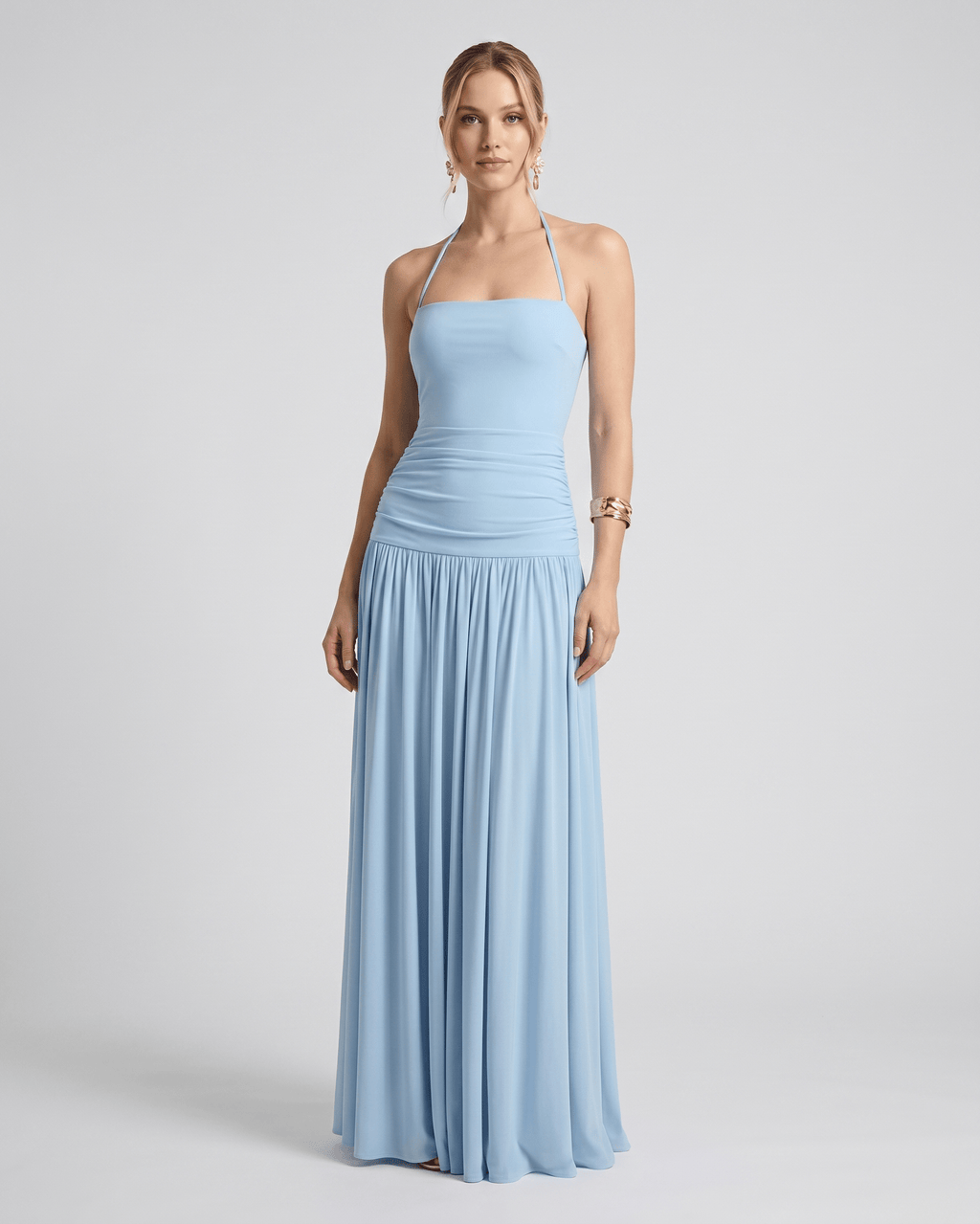 Elara Maxi Dress in soft blue, featuring stretch jersey, halter neck, and flowing full-length skirt by Lauven.