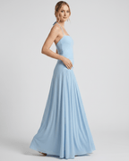 Elara Maxi Dress in light blue, featuring halter neck and ruched waist, made from smooth stretch jersey by Lauven.