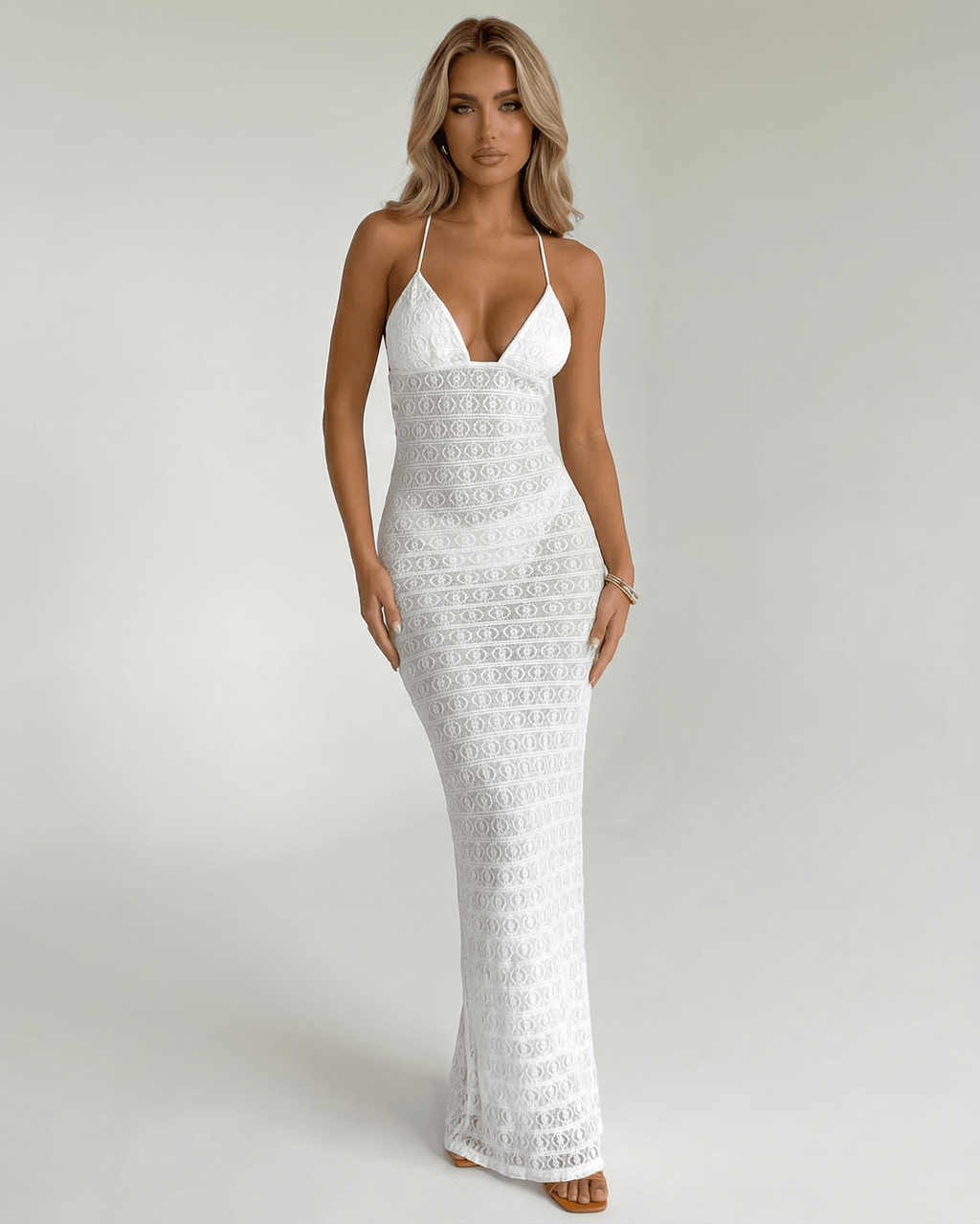 Elara Maxi Dress by Lauven: Elegant white lace V-neck halter dress featuring a sleek silhouette and delicate design.