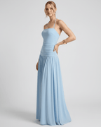 Elara Maxi Dress in light blue, featuring a halter neck, smooth stretch jersey, and fluid full-length skirt by Lauven.