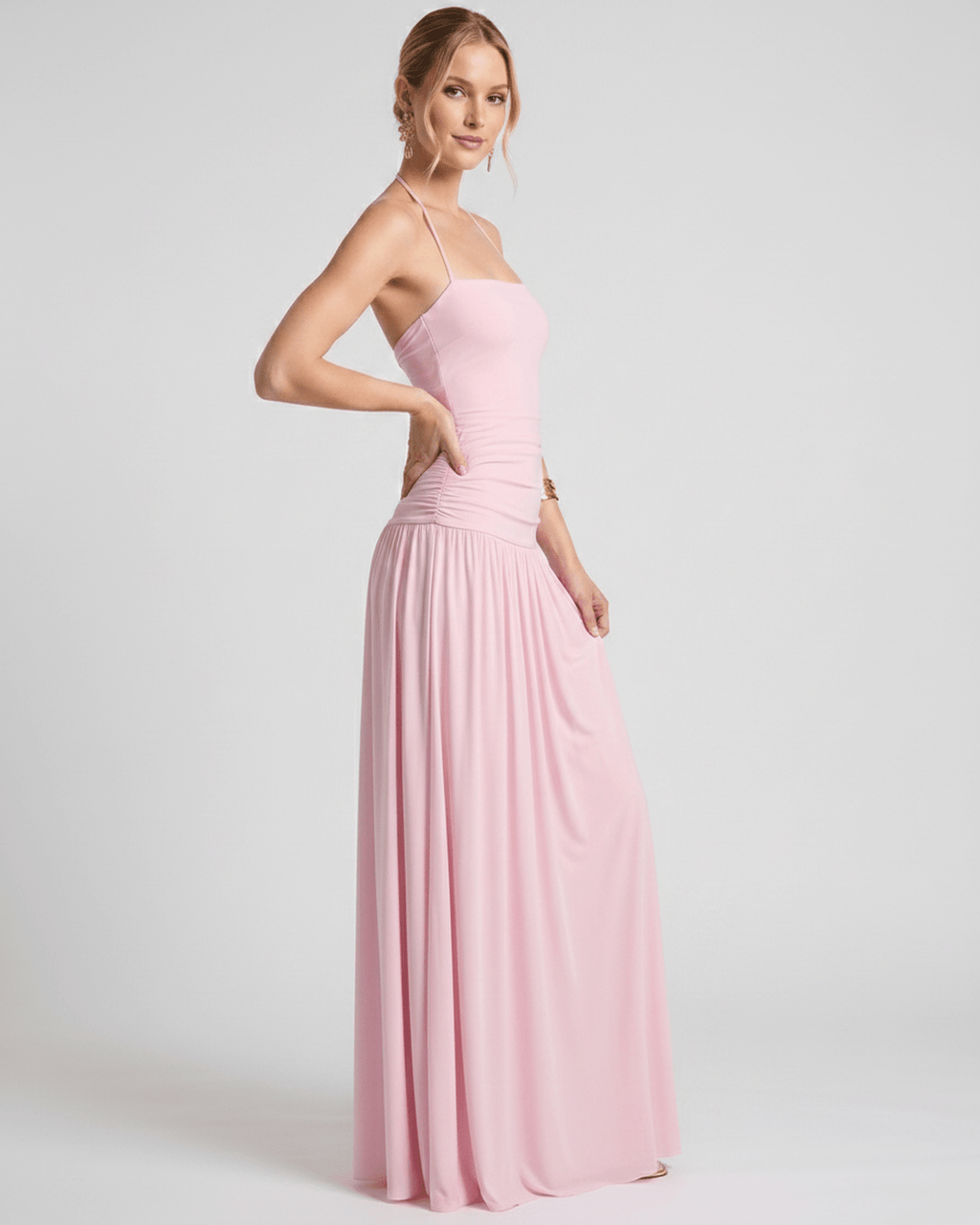 Elara Maxi Dress in soft pink stretch jersey, featuring a halter neck and flattering, fluid skirt for an elegant look by Lauven.