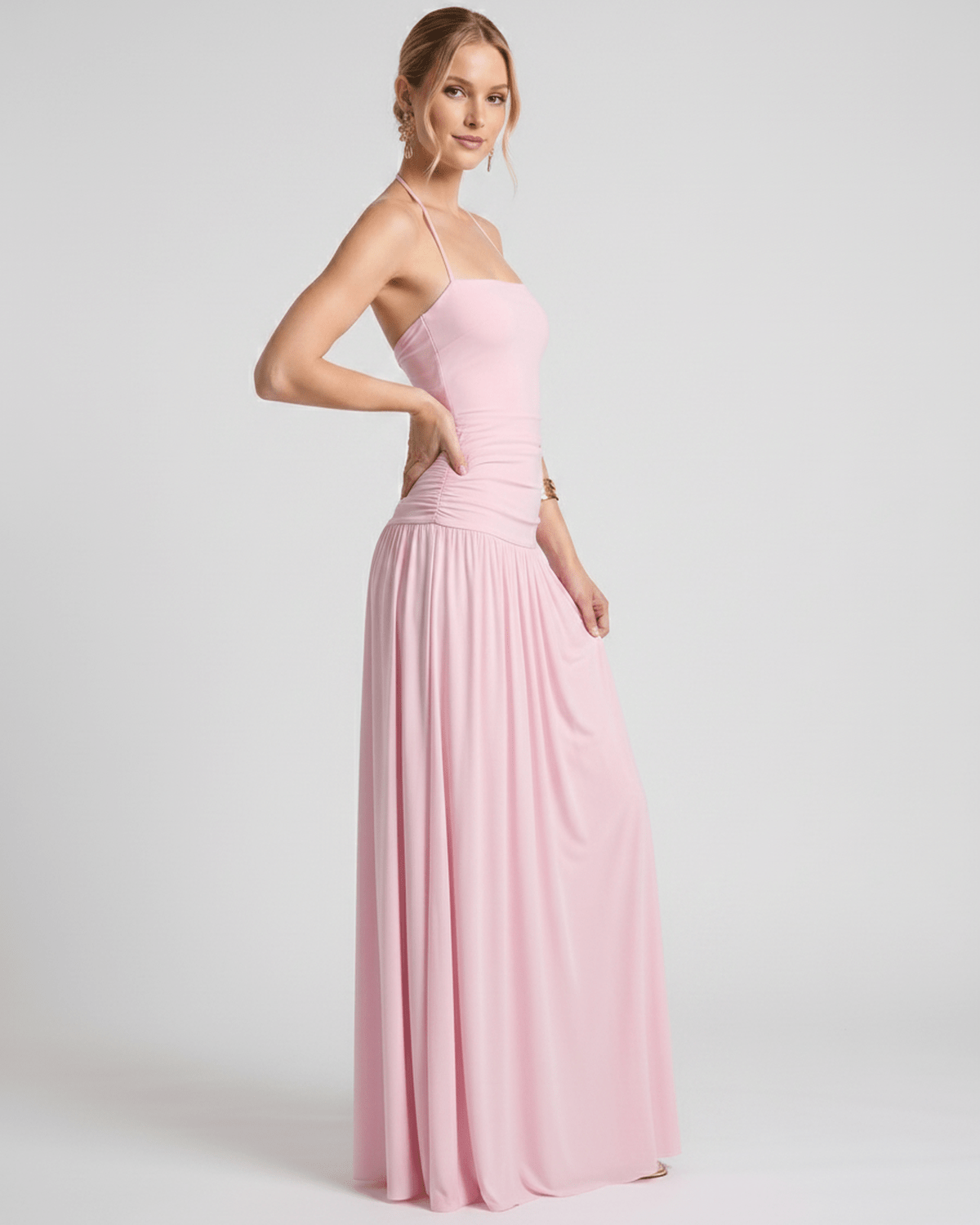 Elara Maxi Dress in soft pink stretch jersey, featuring a halter neck and flattering, fluid skirt for an elegant look by Lauven.