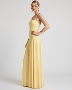 Elara Maxi Dress - Yellow halter neck gown in stretch jersey, featuring ruched waist and a fluid skirt from Lauven.