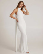Elara Maxi Dress featuring a halter neck, open back, and elongated sash in smooth white jersey by Lauven.