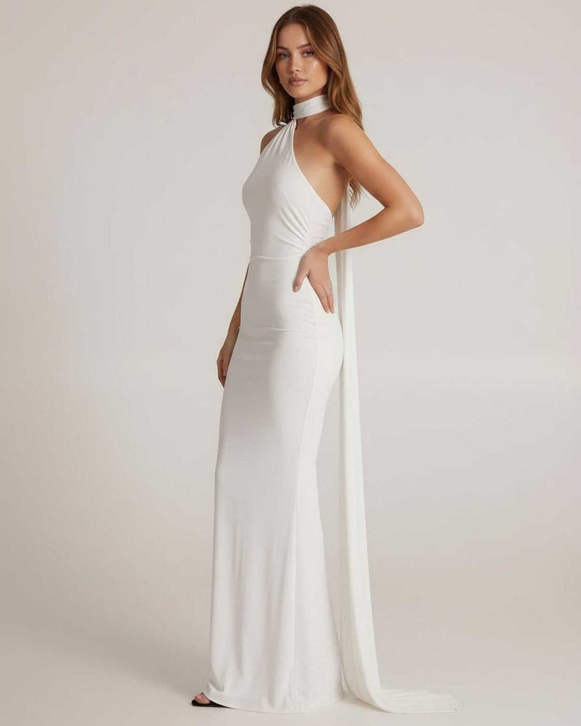 Elara Maxi Dress - White halter neck maxi dress with open back sash detail by Lauven, offering elegance and a luminous finish.