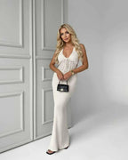 Elara Maxi Dress - White knit maxi dress with deep V-neck, sleeveless cut, elegant ribbed silhouette by Lauven.