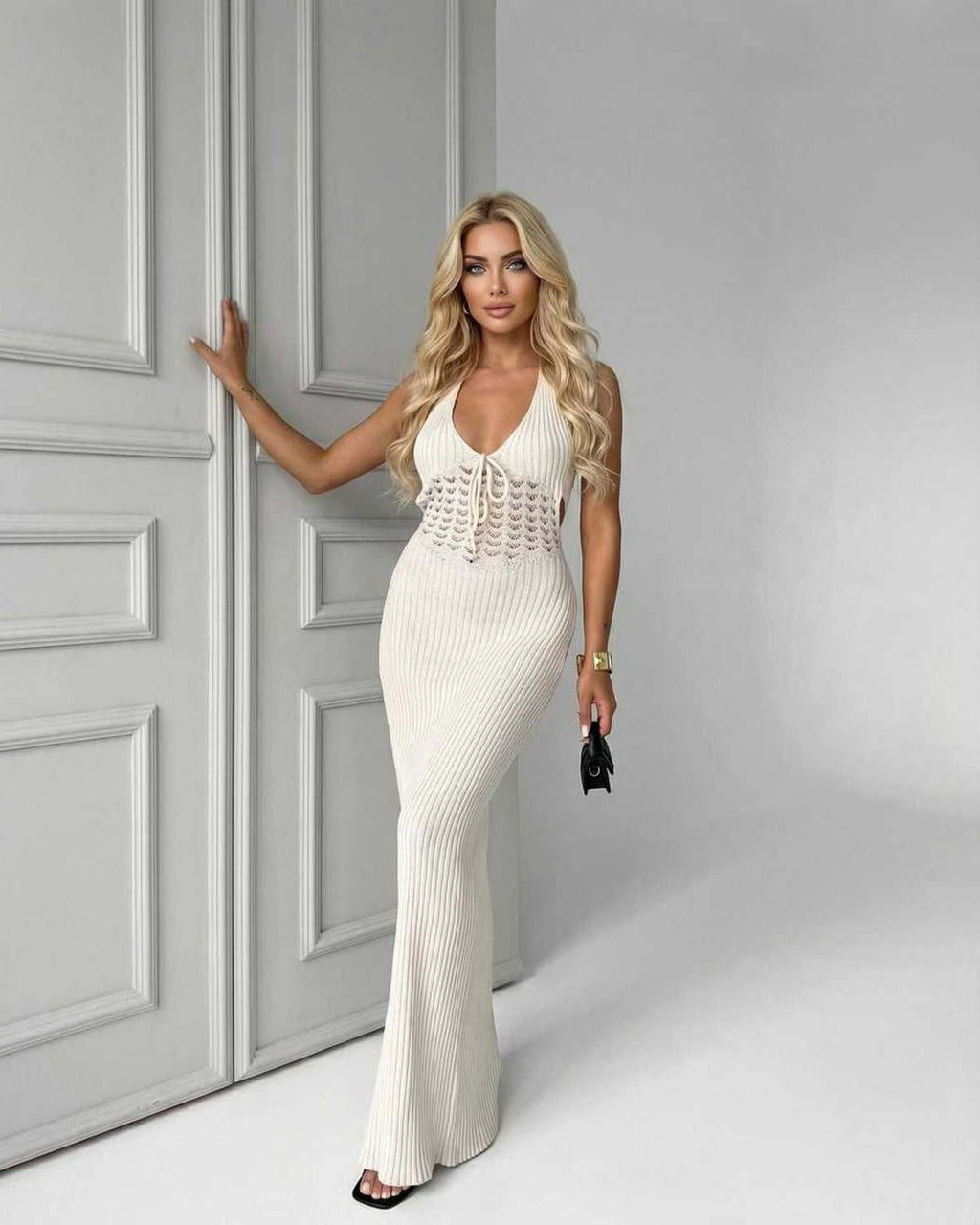 Elara Maxi Dress featuring a white knit design, deep V-neck, ribbed silhouette, and stylish elegance by Lauven.