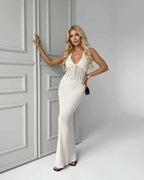 Elara Maxi Dress in white knit with deep V-neck, ribbed silhouette and elegant style by Lauven.