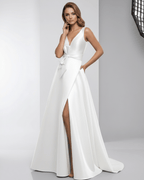 Elara Maxi Dress – White satin A-Line gown with V-neck, slit, bow, showcasing elegance by Lauven.