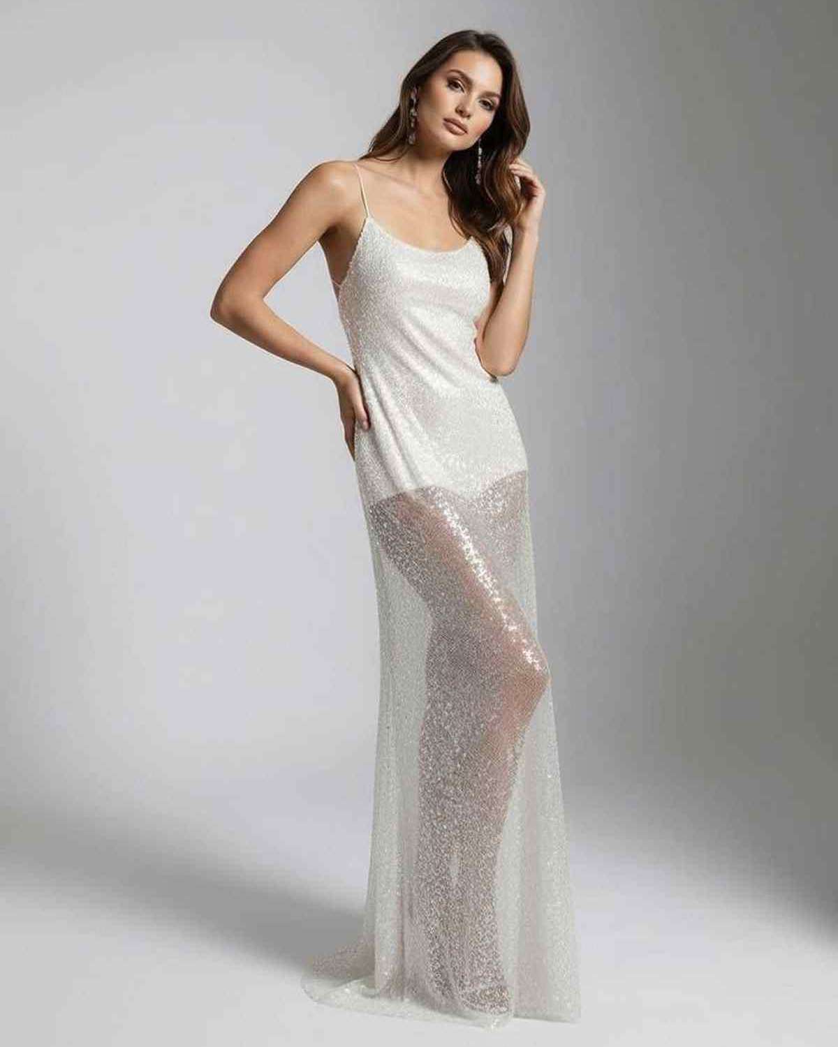 Elara Maxi Dress showcasing a white sequin design with strappy back, exuding elegance and a fluid silhouette by Lauven.