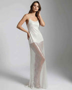 Elara Maxi Dress featuring a white sequin design, strappy back, and sheer overlay for a luminous, elegant look by Lauven.