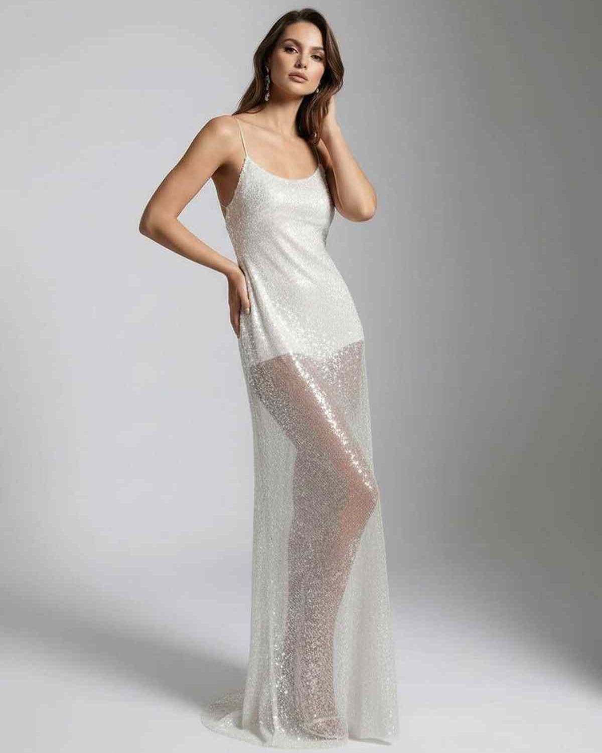 Elara Maxi Dress featuring a white sequin design, strappy back, and sheer overlay for a luminous, elegant look by Lauven.