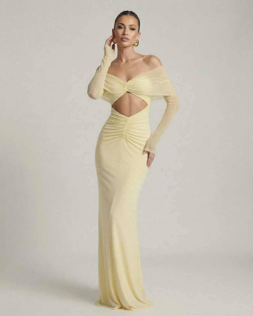 Elara Maxi Dress showcasing off-shoulder mesh sleeves, ruched cut-out detail, and elegant yellow design by Lauven.