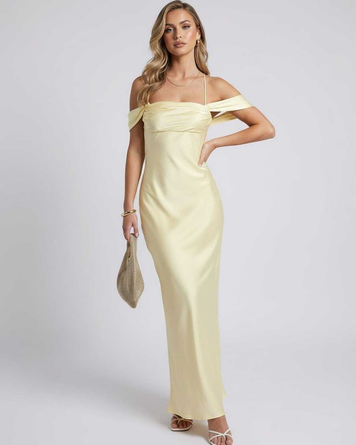 Elara Maxi Dress in yellow with off-the-shoulder slip silhouette by Lauven, featuring a satin-like finish for an elevated look.