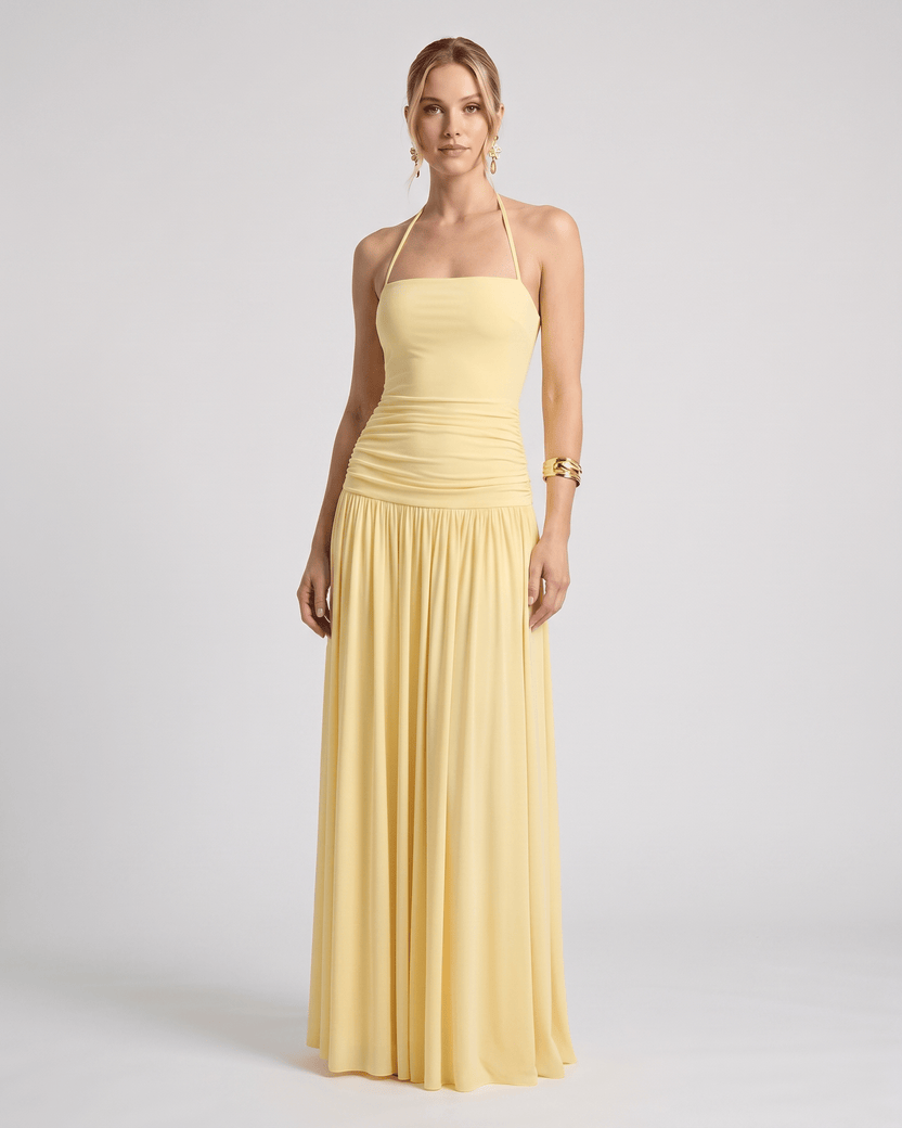 Elara Maxi Dress in yellow, featuring a halter neck, smooth stretch jersey, and a flattering silhouette by Lauven.