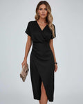 Elara Midi Dress by Lauven – Elegant black wrap dress featuring a modern feminine silhouette.