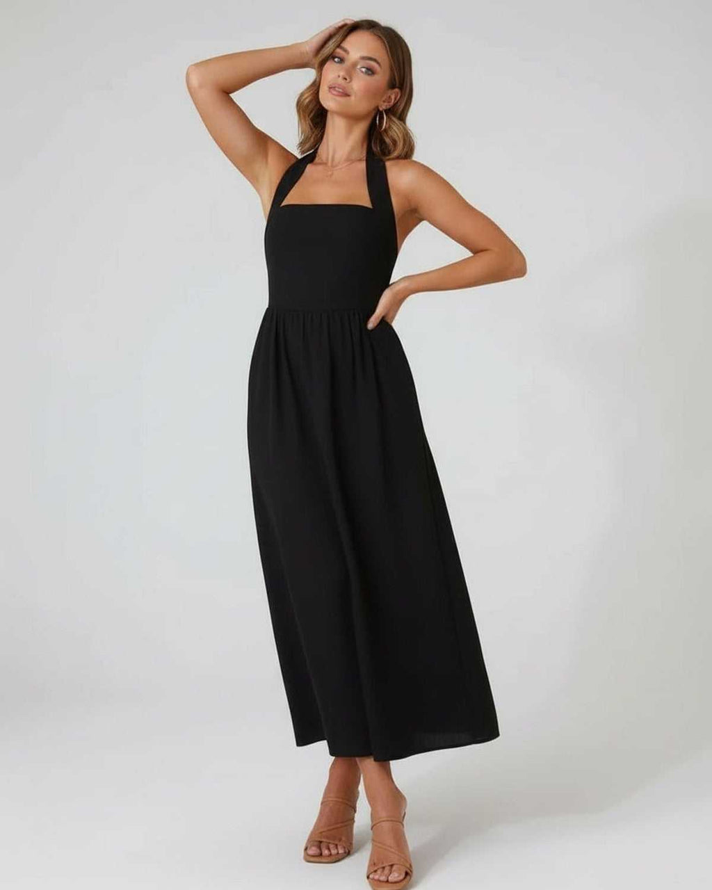 Elara Midi Dress - Elegant black halter midi dress with flowy A-line silhouette by Lauven, perfect for all-day wear.