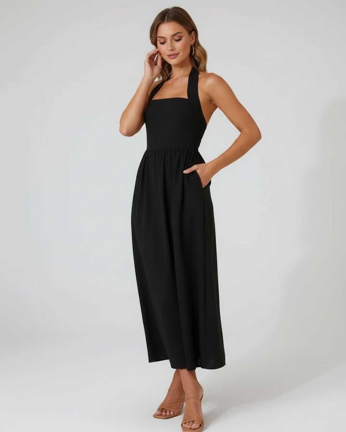 Elara Midi Dress – Elegant black halter midi dress with flowing A-line silhouette by Lauven, flattering and modern.