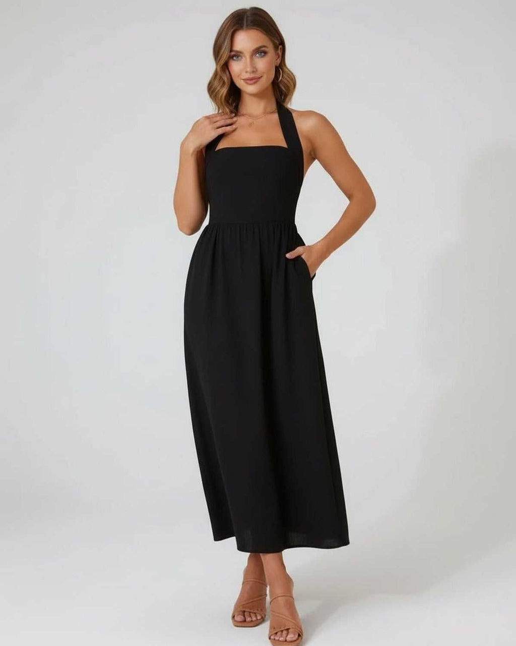 Elara Midi Dress - Elegant black halter midi dress with A-line silhouette by Lauven, perfect for timeless elegance.