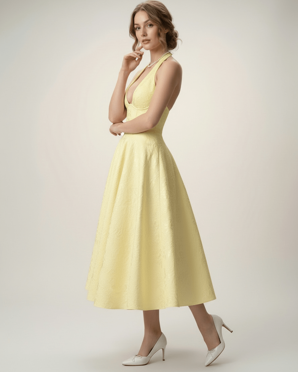 Elara Midi Dress in yellow, elegant halter A-line silhouette, showcasing sophistication by Lauven.