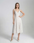 Elara Midi Dress by Lauven featuring an elegant A-line silhouette and polka dot detail on a model.