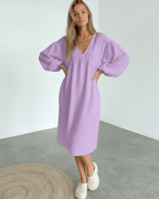 Elara Midi Dress in lavender cotton with puff sleeves, embodying soft elegance from Lauven brand.