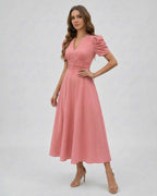 Elara Midi Dress in pink with sleeves, featuring a V-neckline and cinched waist, perfect for wedding guests by Lauven.