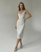 Elara Midi Dress by Lauven in a satin-effect finish, showcasing a sleek split design and spaghetti straps.
