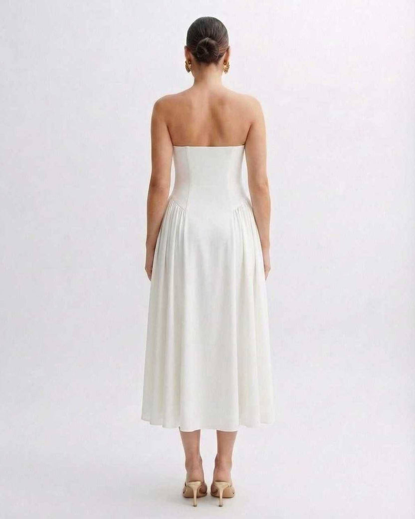 Elara Midi Dress back view, strapless white pleated design showcasing modern elegance by Lauven.