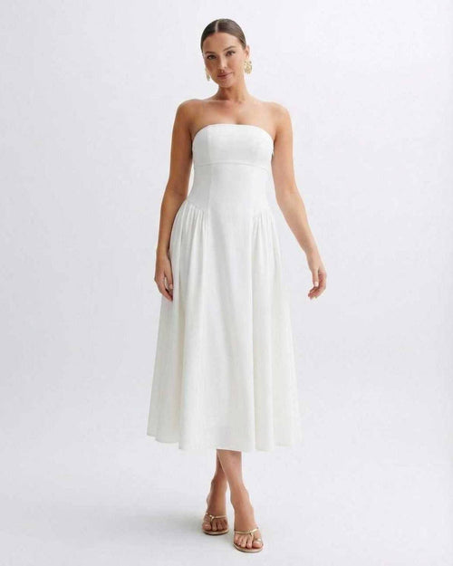 Elara Midi Dress by Lauven, a strapless white pleated dress with a clean bandeau neckline, capturing timeless elegance.