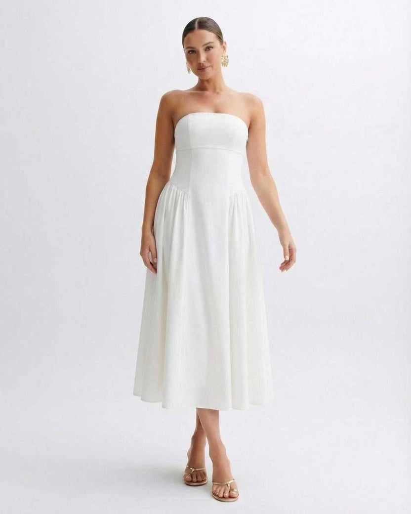 Elara Midi Dress by Lauven, a strapless white pleated dress with a clean bandeau neckline, capturing timeless elegance.
