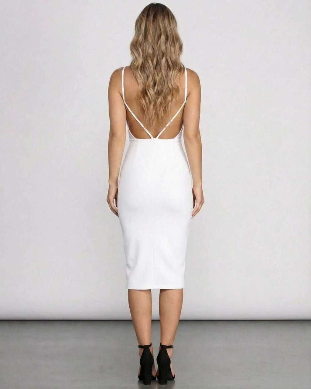 Elara Midi Dress – Back view of a white bodycon midi dress with open back, elegant silhouette from Lauven.