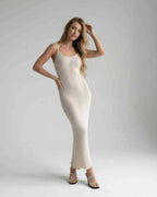 Elara Midi Dress featuring a sleek white bodycon design with a sleeveless silhouette by Lauven, perfect for any occasion.
