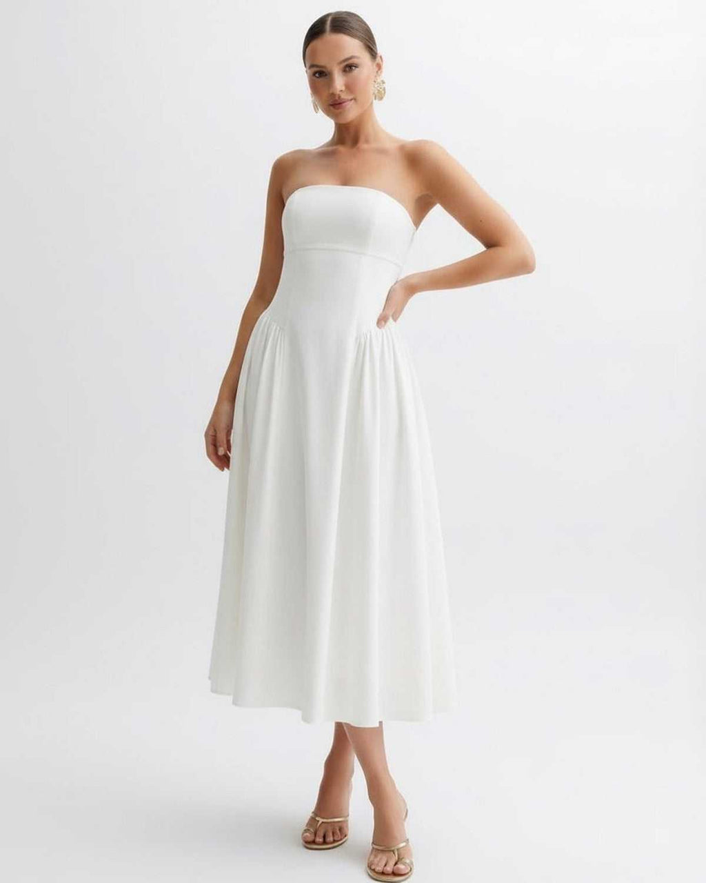 Elara Midi Dress - Strapless white pleated dress by Lauven, showcasing elegance and grace.