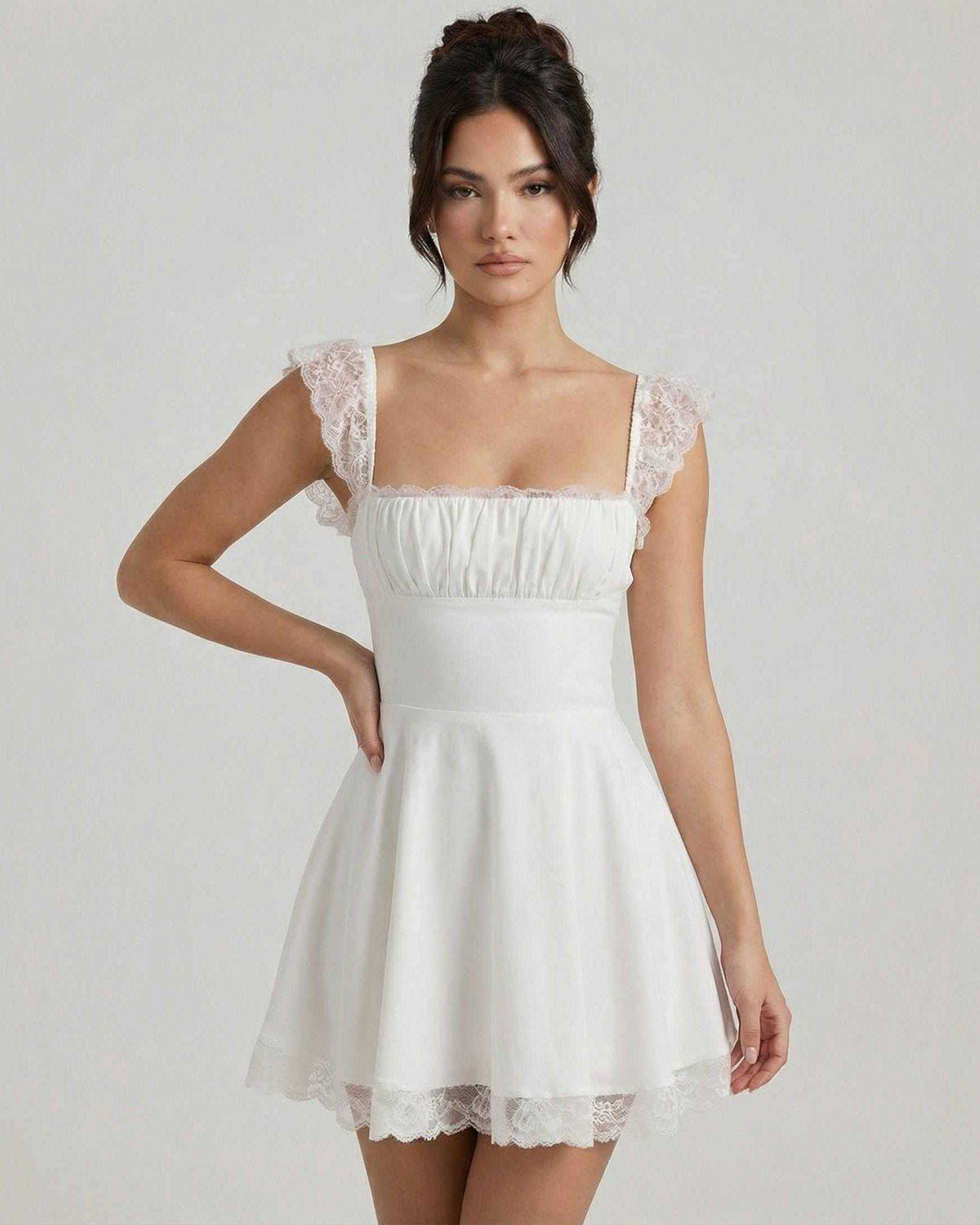 Elara Mini Dress by Lauven, featuring lace cap sleeves and a vintage A-line silhouette in soft white fabric.