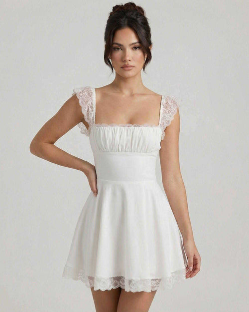 Elara Mini Dress by Lauven, featuring lace cap sleeves and a vintage A-line silhouette in soft white fabric.