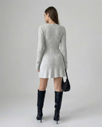Elara Mini Dress by Lauven - Long Sleeve Knit design with Bow Detail, showcasing a polished silhouette in a light grey color.