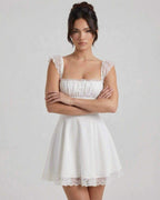 Elara Mini Dress by Lauven - White lace A-line dress with structured bodice and cap sleeves.