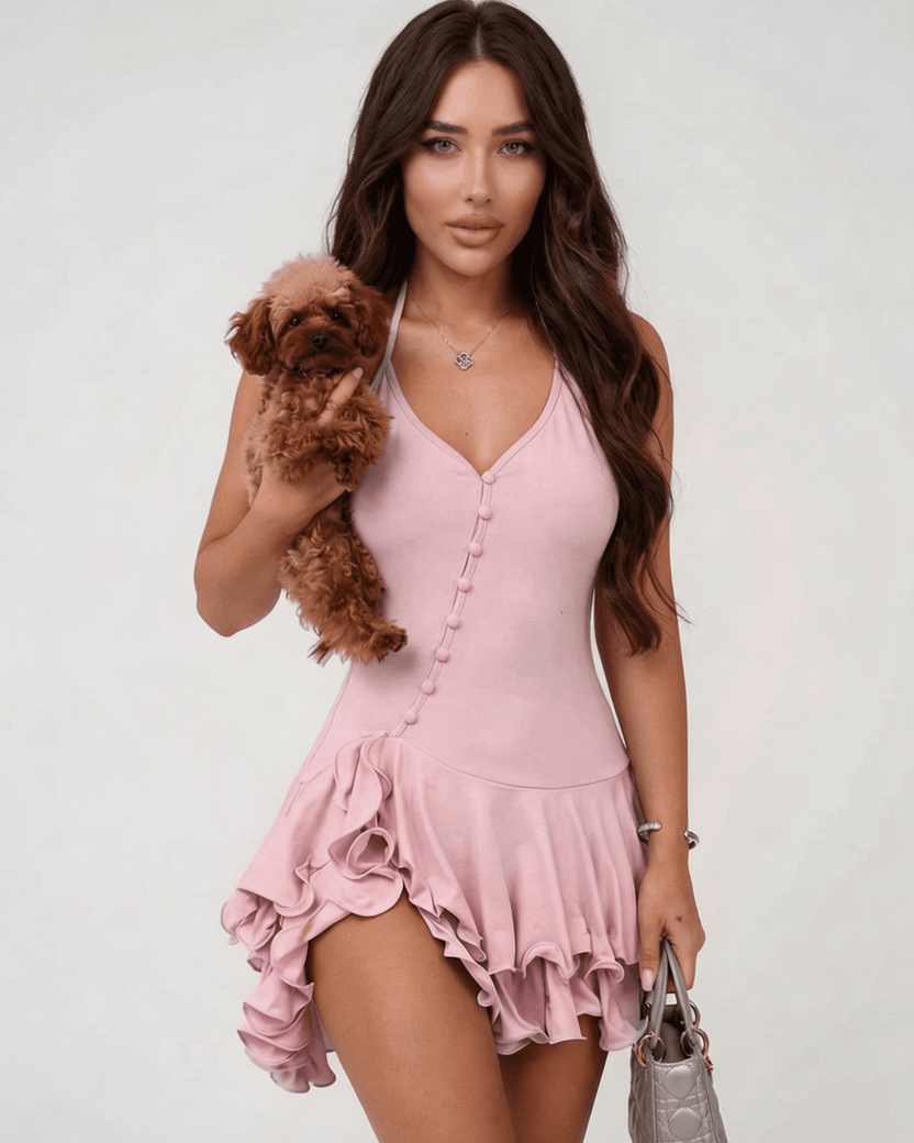 Elara Mini Dress by Lauven, pink ruffle hem halter neck dress, styled with a small dog.