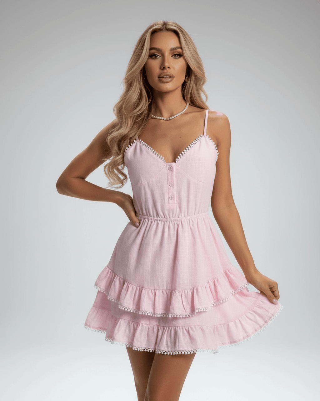 Elara Mini Dress by Lauven, soft pink with tiered ruffle skirt and lace trim, perfect for a feminine summer look.